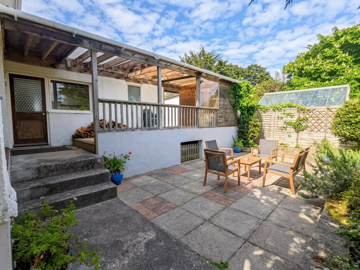 4d1054aa-9ac4-41a0-a213-b7a13d65fc6d The back patio gets great sun in the morning - great for a breakfast cuppa